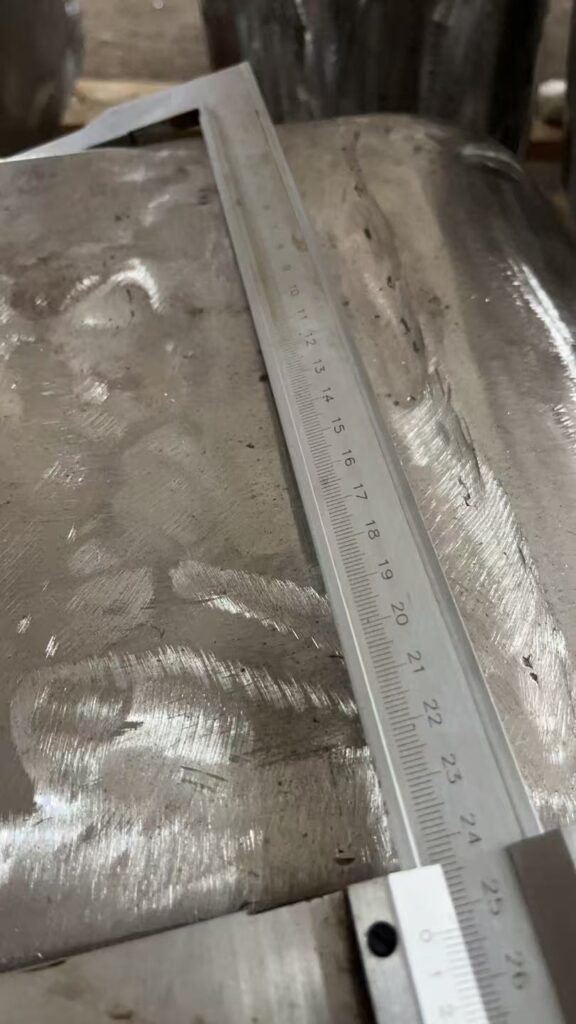 Caliper measuring main body of welded steel part